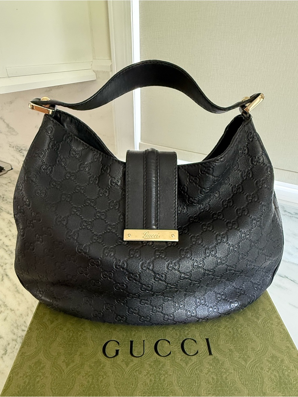 Gucci Black GG Embossed Leather Hobo with Gold Plaque